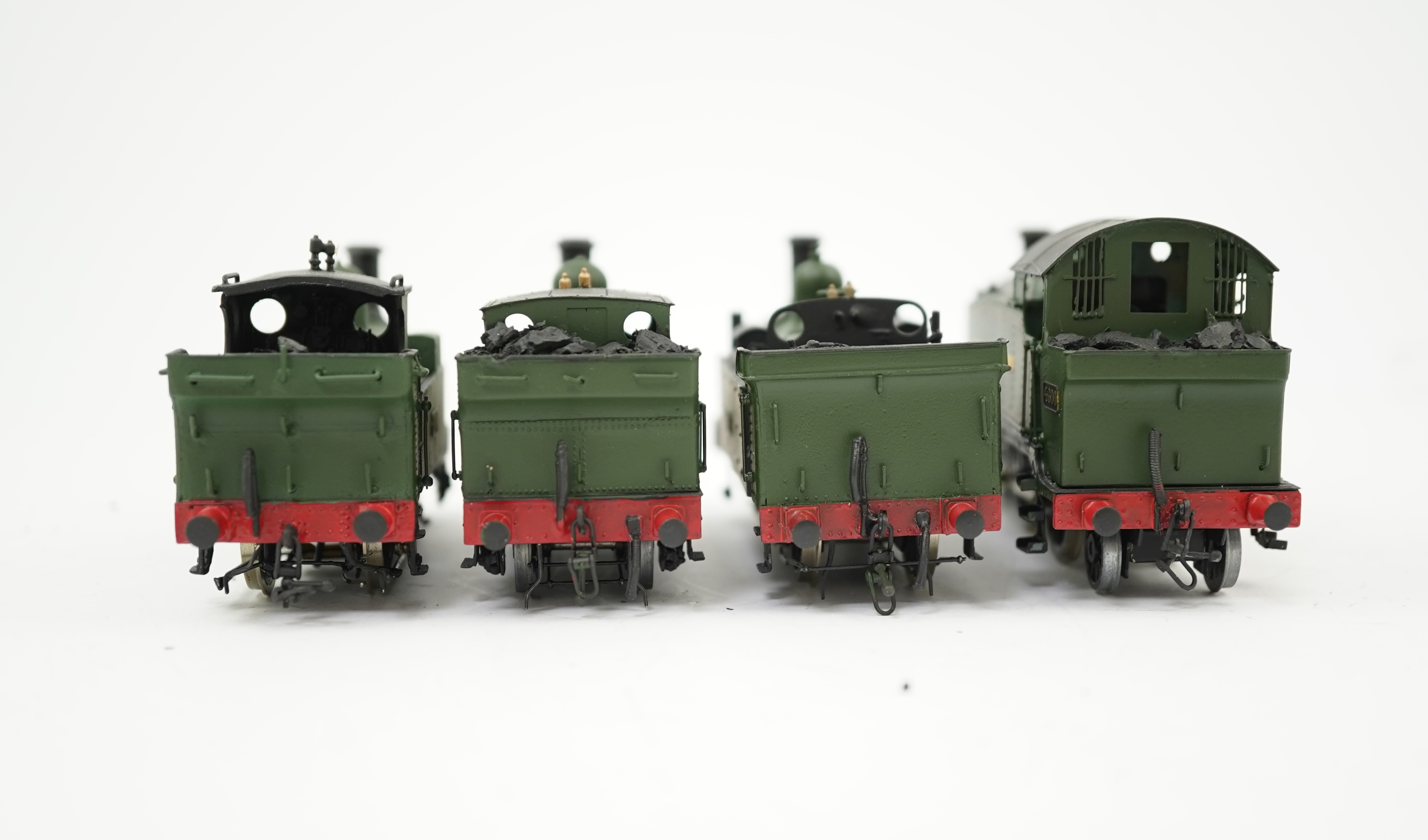 Four 00 gauge kit built GWR tank locomotives, three brass and white metal; a 14xx class 2-4-0T, 1458, together with an 517 class 0-4-2T, 574, and a 633 class 0-4-2T, 633, plus a plastic/resin and metal 46xx class 4-4-2T,